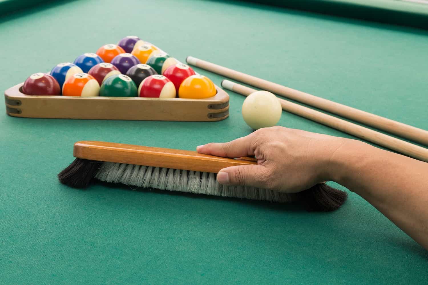 up-hand-brushing-snooker-pool-billards-table-with-bal-2021-08-30-18-49-45-utc.jpg